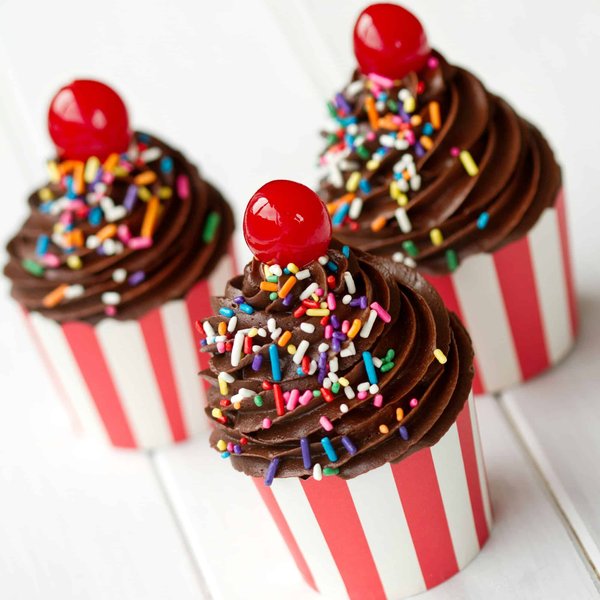 What are the detailed steps to replace the windshield wipers on a British luxury vehicle?